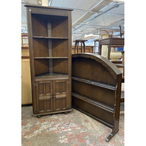 63 - Two pieces of Priory oak furniture, one plate rack and one corner cabinet