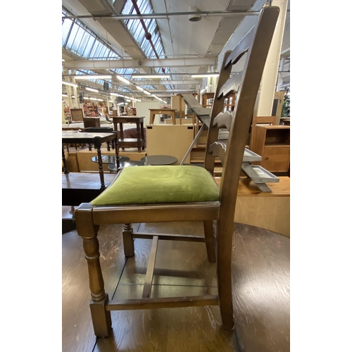 65 - A Priory oak dining table and four green fabric upholstered chairs - approx. 78cm high x 122cm wide ... 