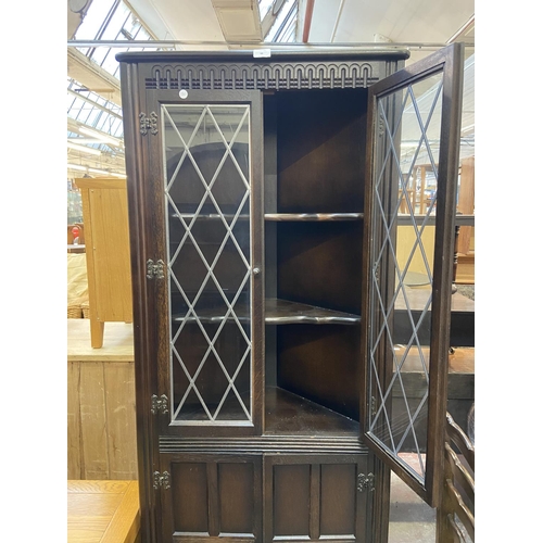 66 - A Priory carved oak and lead glazed free standing corner cabinet - approx. 168cm high x 67cm wide x ... 