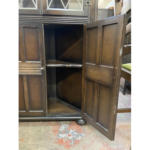 66 - A Priory carved oak and lead glazed free standing corner cabinet - approx. 168cm high x 67cm wide x ... 