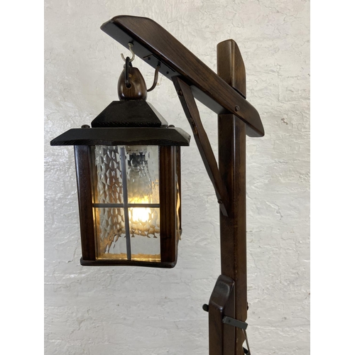 67 - A Priory oak and beech hangman style floor lamp - approx. 150cm high