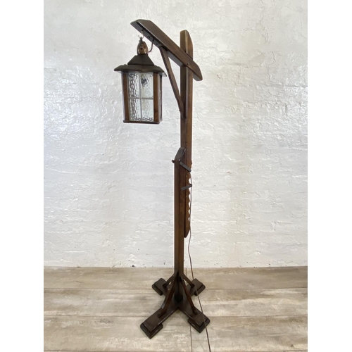 67 - A Priory oak and beech hangman style floor lamp - approx. 150cm high