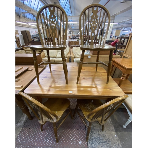 70 - A Victorian style pine farmhouse dining table and four beech wheel back dining chairs - table approx... 