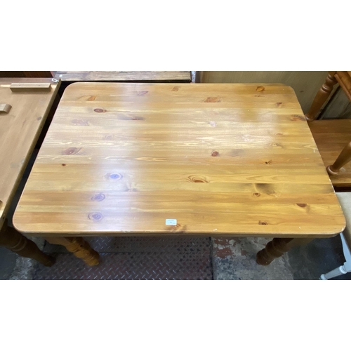 70 - A Victorian style pine farmhouse dining table and four beech wheel back dining chairs - table approx... 