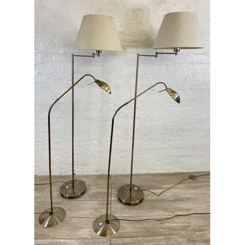 71 - Four contemporary brass effect floor lamps, two B&Q and two Massive