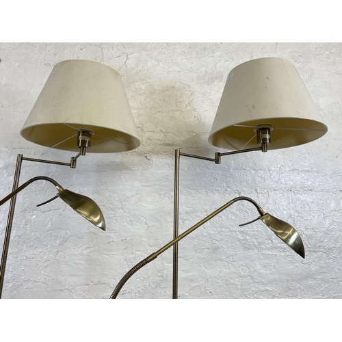 71 - Four contemporary brass effect floor lamps, two B&Q and two Massive