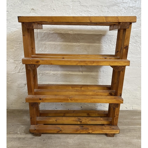 79 - Four pieces of furniture, one teak magazine rack, one pine shoe rack, one hardwood nest of tables an... 