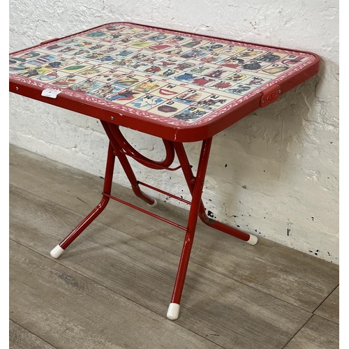 8 - A mid 20th century N.K. red plastic and tubular metal folding Thai alphabet child's table - approx. ... 