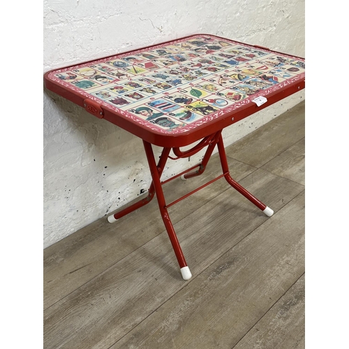 8 - A mid 20th century N.K. red plastic and tubular metal folding Thai alphabet child's table - approx. ... 