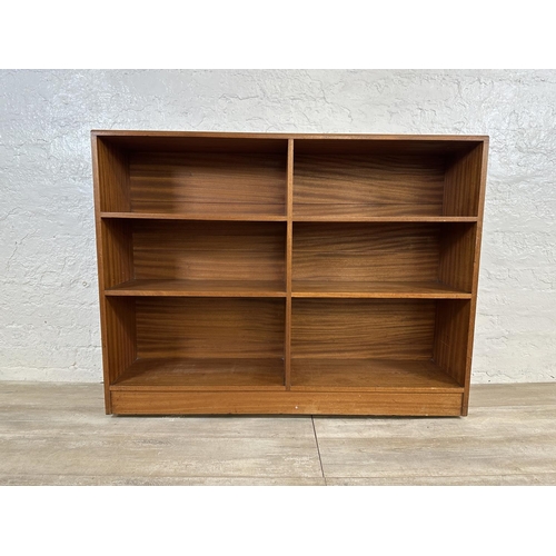 82 - A mid 20th century teak bookcase - approx. 94cm high x 122cm wide x 28cm deep