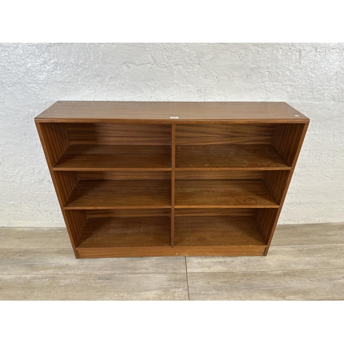 82 - A mid 20th century teak bookcase - approx. 94cm high x 122cm wide x 28cm deep