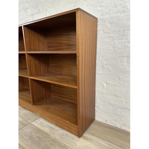 82 - A mid 20th century teak bookcase - approx. 94cm high x 122cm wide x 28cm deep