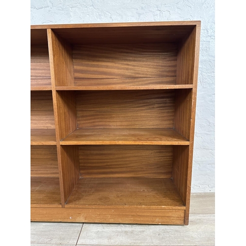 82 - A mid 20th century teak bookcase - approx. 94cm high x 122cm wide x 28cm deep