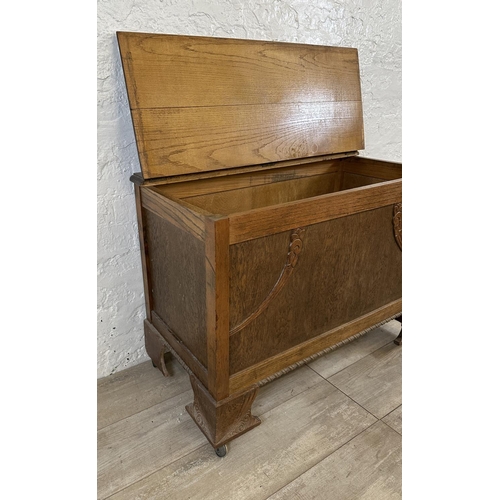 83 - An Art Deco carved oak blanket box - approx. 65cm high x 88cm wide x 43cm deep