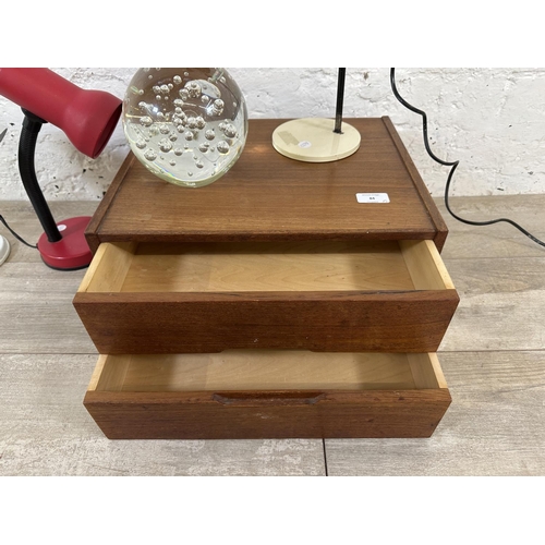 84 - Five items, one mid 20th century teak two drawer index filing cabinet, three desk lamps and one larg... 