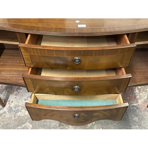 95 - A Regency style inlaid mahogany serpentine sideboard - approx. 87cm high x 145cm wide x 50cm deep