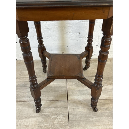 98 - An Edwardian mahogany octagonal two tier side table