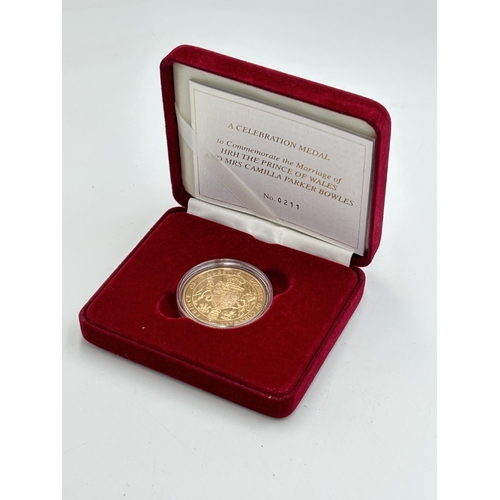 2297 - A boxed Royal Mint 22ct gold proof Celebration Medal to Commemorate the Marriage of HRH The Prince o... 