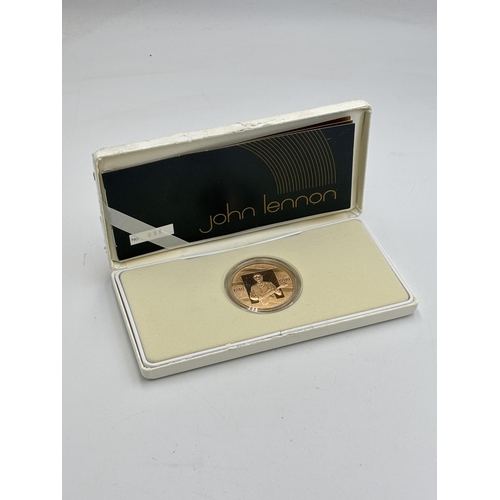 2299 - A boxed Royal Mint 1940-1980 John Lennon 22ct gold proof medal with certificate - approx. gross weig... 