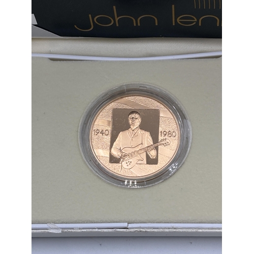 2299 - A boxed Royal Mint 1940-1980 John Lennon 22ct gold proof medal with certificate - approx. gross weig... 