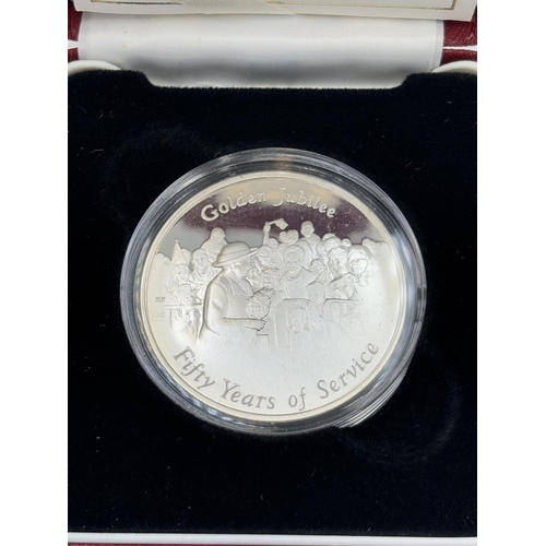 2315 - A boxed The Royal Mint 2002 Golden Jubilee .925 silver proof medal with certificate of authenticity ... 