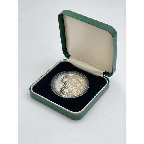 2316 - A boxed The Royal Mint 1989 Alderney Royal Visit .925 silver proof £2 coin