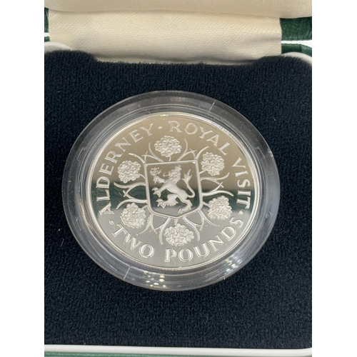 2316 - A boxed The Royal Mint 1989 Alderney Royal Visit .925 silver proof £2 coin