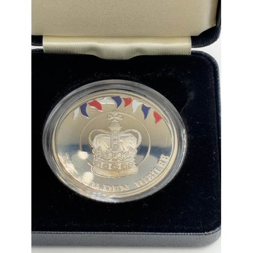 2344 - A boxed Valcambi sa, Switzerland Falkland Islands 'The Golden Jubilee' St Edward's Crown 50p proof c... 