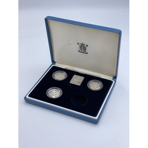 2359 - A boxed Royal Mint United Kingdom .925 silver Piedfort £1 coin collection with platinum plated medal... 