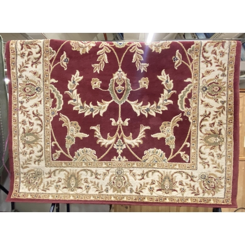 191 - A Dunelm Legacy red ground rug - approx. 237cm x 160cm