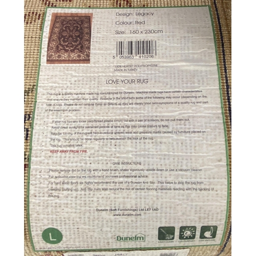 191 - A Dunelm Legacy red ground rug - approx. 237cm x 160cm