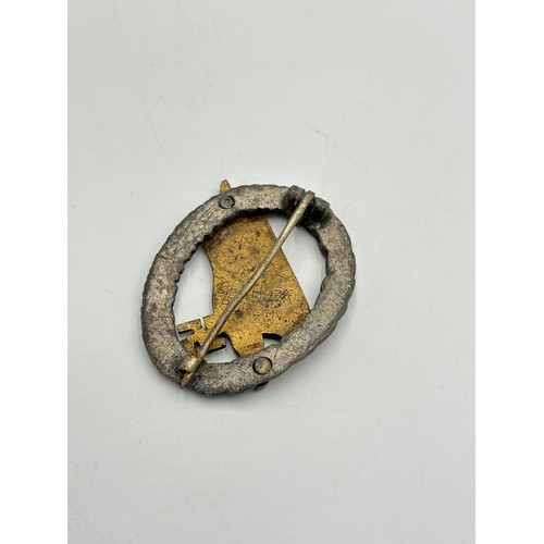 2292 - A reproduction German style paratroopers badge, marked 'Brehmer Berlin.3' to reverse