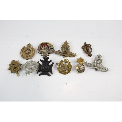 2275 - Ten military cap badges