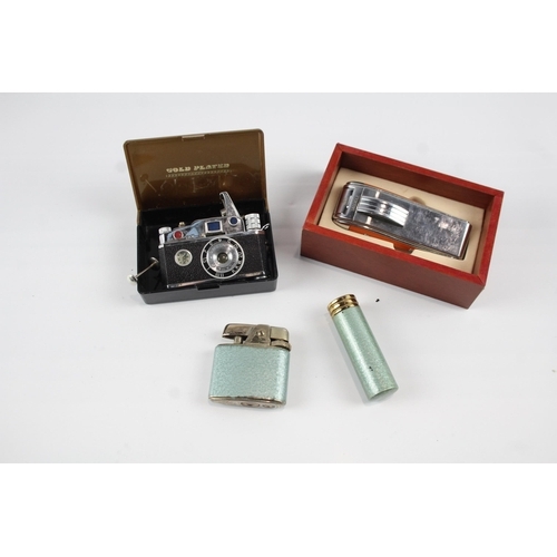 2264 - Four vintage novelty cigarette lighters