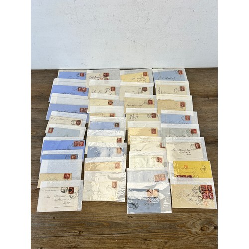 525 - A large collection of 19th century and later letters, envelopes and postcards with stamps to include... 