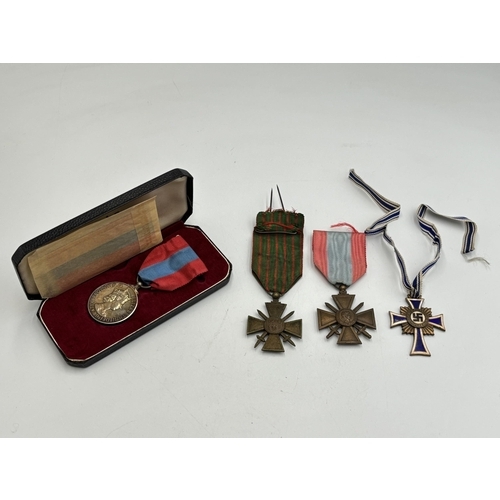 2293 - Four medals, one boxed Imperial Service presented to Edith Vera Norris, two French Croix de Guerre a... 