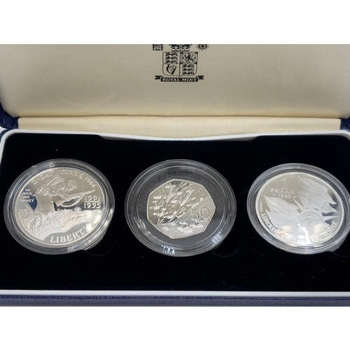 2312 - A boxed 1991-1995 World War II 50th Anniversary three coin silver proof set comprising The Royal Min... 