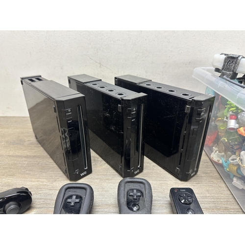 580 - Three Nintendo Wii consoles with accessories