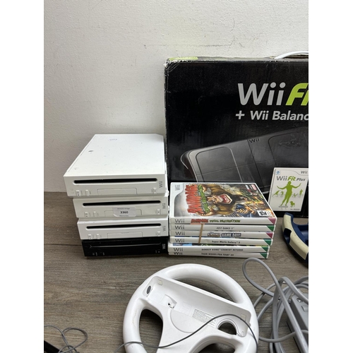 584 - Four Nintendo Wii consoles with games and accessories