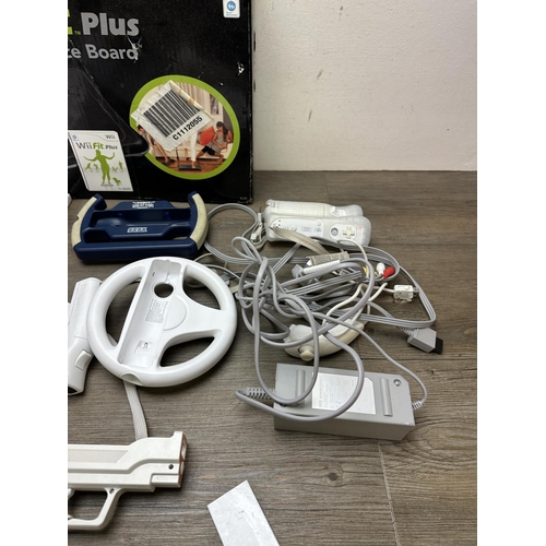 584 - Four Nintendo Wii consoles with games and accessories