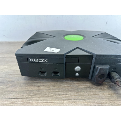 590 - A Microsoft Xbox console with two controllers