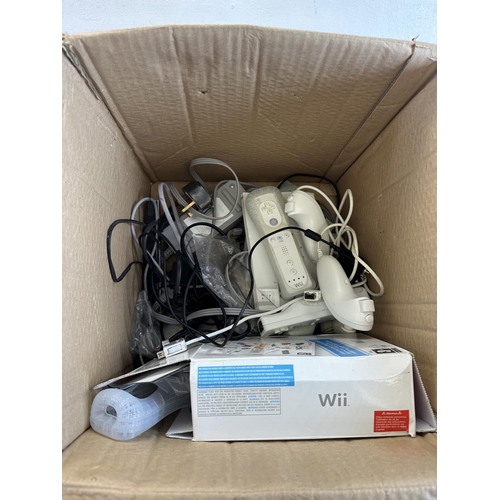 596 - Two Nintendo Wii consoles with games and accessories