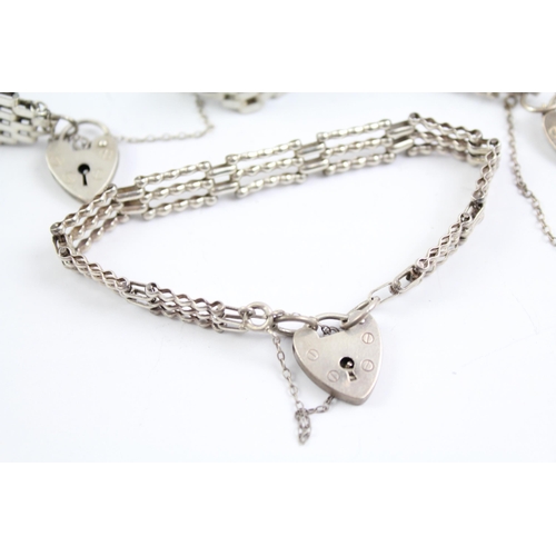 2067 - Three sterling silver gate bracelets with heart padlock clasps - approx. gross weight 43g