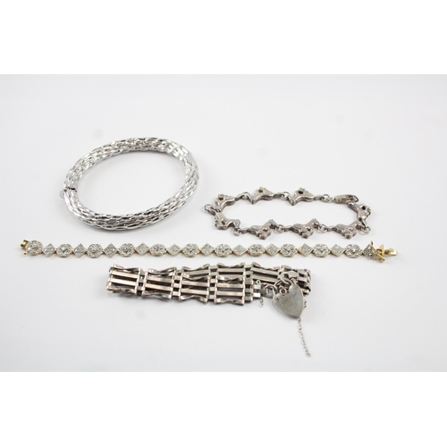 2071 - Four sterling silver bracelets to include gate, bangle, diamond etc. - approx. gross weight 68g