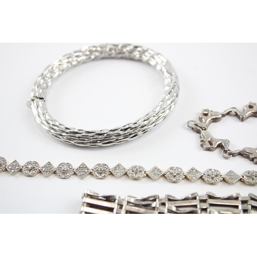 2071 - Four sterling silver bracelets to include gate, bangle, diamond etc. - approx. gross weight 68g