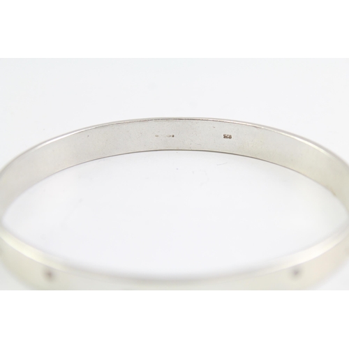 2091 - Two sterling silver gemstone bangles, one diamond and one opal - approx. gross weight 44g