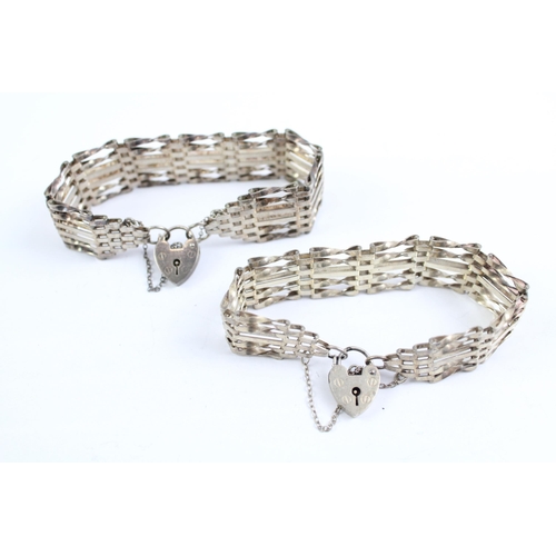 2093 - Two sterling silver gate bracelets with heart padlock clasps - approx. gross weight 40g