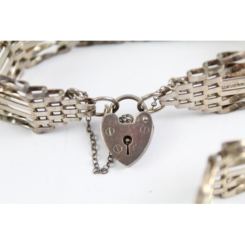 2093 - Two sterling silver gate bracelets with heart padlock clasps - approx. gross weight 40g