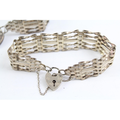 2093 - Two sterling silver gate bracelets with heart padlock clasps - approx. gross weight 40g