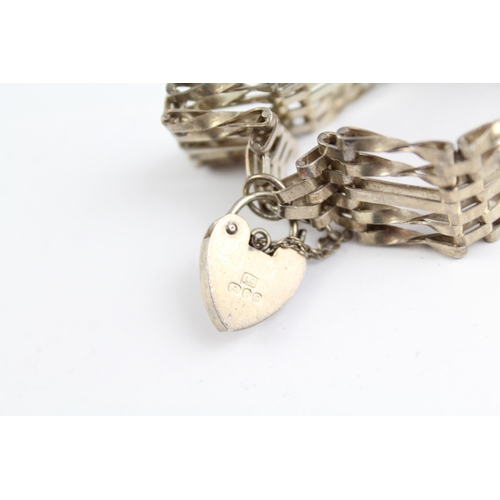 2093 - Two sterling silver gate bracelets with heart padlock clasps - approx. gross weight 40g